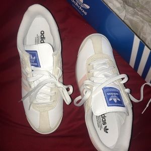 all white / pink striped adidas !